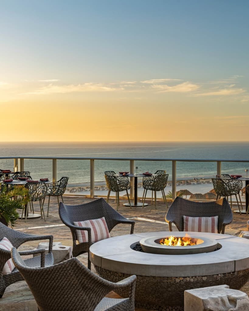 Firepit terrace overlooking the ocean at sunset