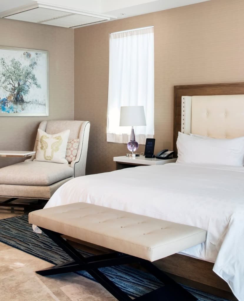 Resort suite bedroom with neutral tones