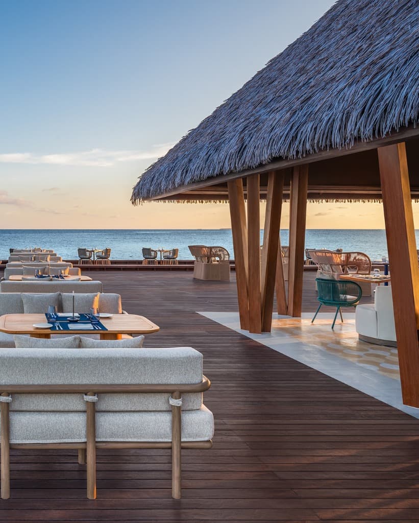 Beachfront lounge deck at sunset